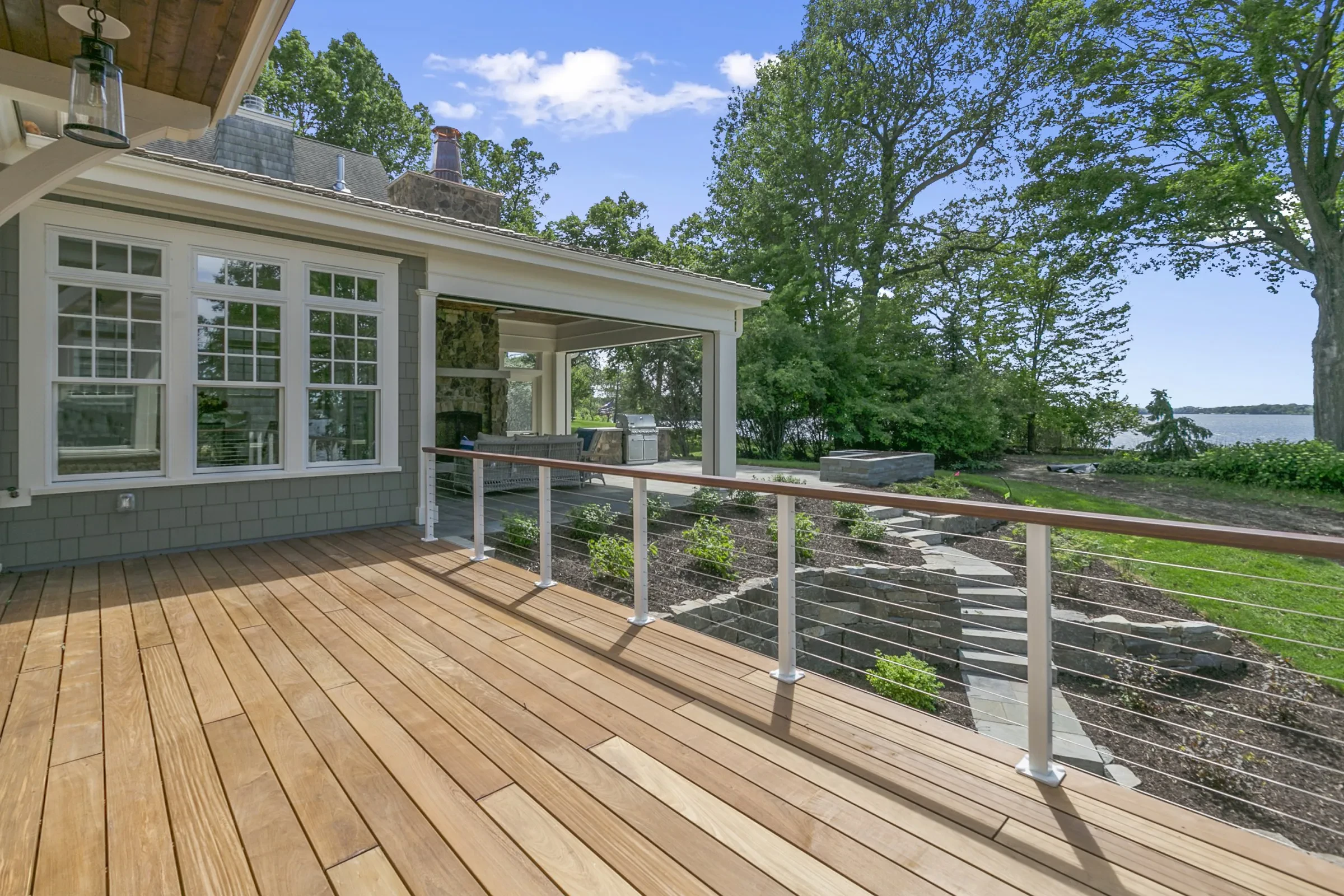 A custom deck with railings built by Innovation Painting & Remodeling.