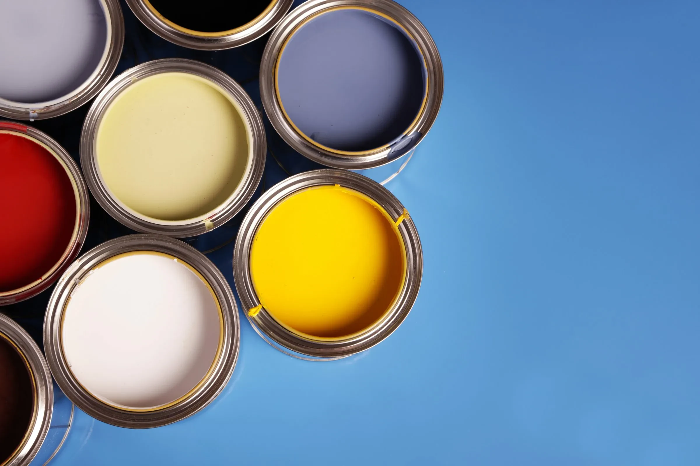 Premium paint cans staged for an Innovation Painting & Remodeling project.