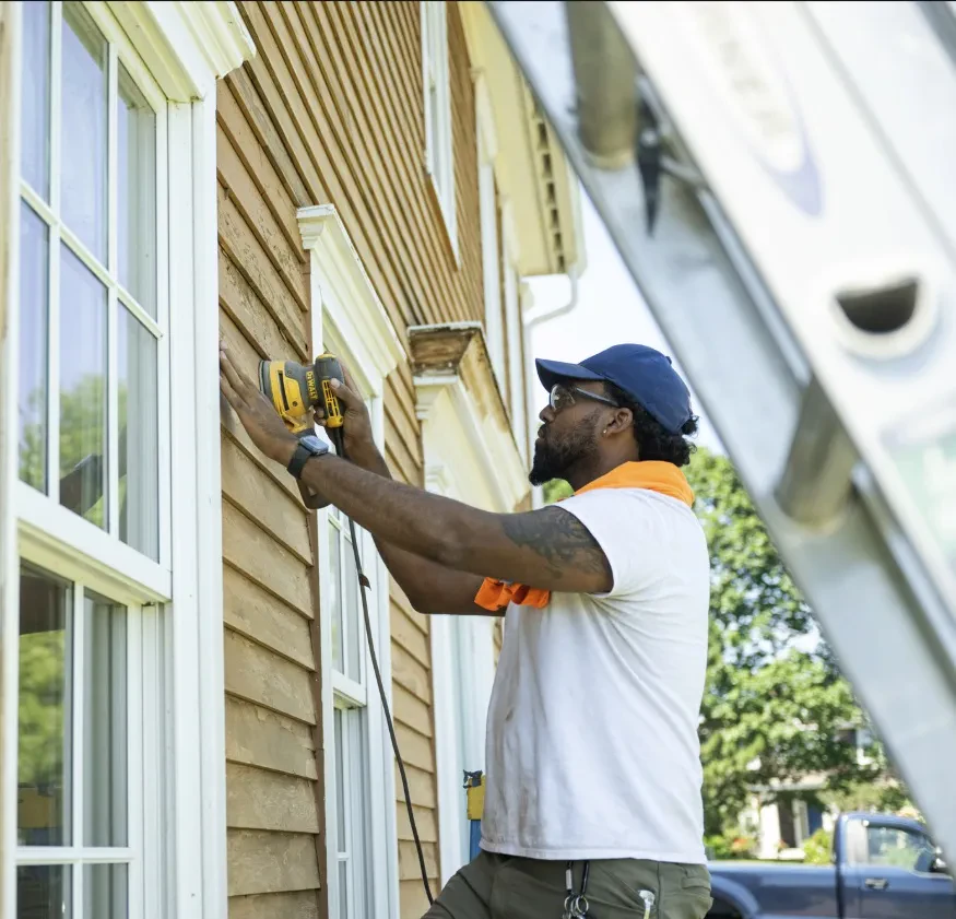 An Innovation Painting & Remodeling team member at work on site.